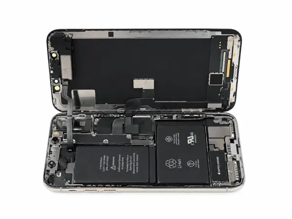 iPhone 11 logic board repair under a microscope in Dubai