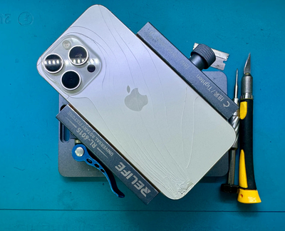 What is hidden in iPhone back glass and what damage occurs if it breaks