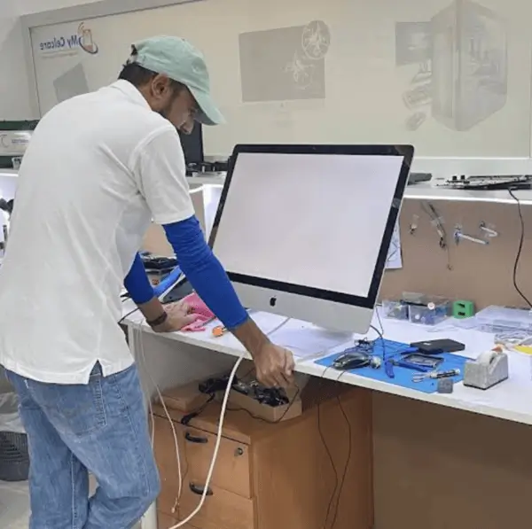 My Celcare JLT laptop repair technician working on a laptop in Dubai